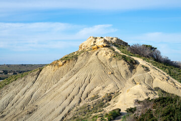 View on the Clay cliffs at Gnejna Bay near the village of Mgarr, Malta. Hiking and discovering the nature of Malta