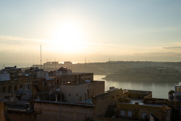 Mesmerizing Sunrise over the Iconic Cityscape of Valetta. Warm, golden light illuminating the city of Valetta