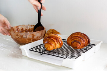 Traditional croissants ready for decoration on a grid