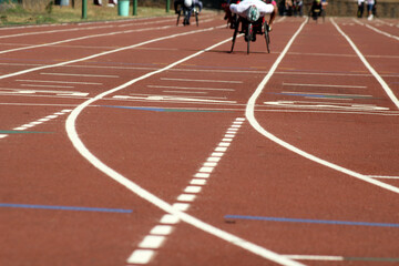 wheelchair paralympic athletes training in morning session on running track