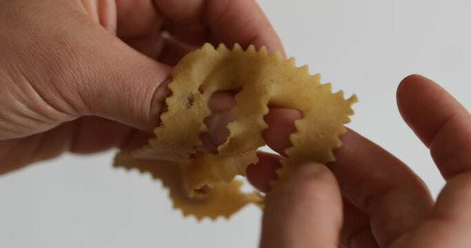 Hands at work: zooming in on the intricate dance of fingers as chebakia dough takes on its final, beautiful form.