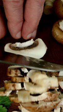 Raw royal champignon mushrooms cut into slices.