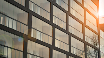 Modern apartment buildings exteriors. Facade of a modern housing construction with glass balconies.