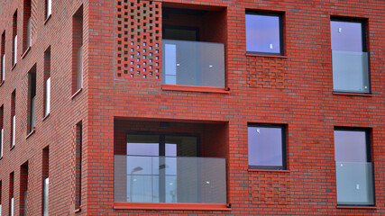 Modern apartment building for residential living in red brick stone