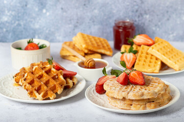 set of different waffles with strawberries