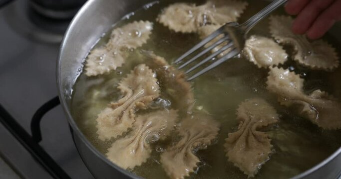 Fried elegance: chebakia emerges from the hot oil as a beautifully golden, intricately shaped delight