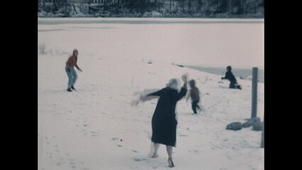 Snowball Fight 1965 - A family enjoys a snowball fight in the winter - Powered by Adobe