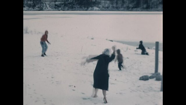 Snowball Fight 1965 - A family enjoys a snowball fight in the winter 