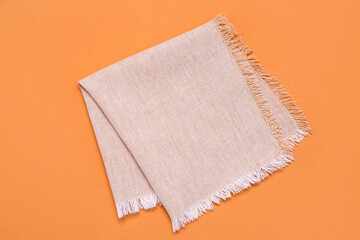 Folded napkin on color background