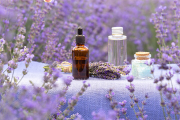 Amber essential lavender oil bottle. Violet lavendar field in Provence.