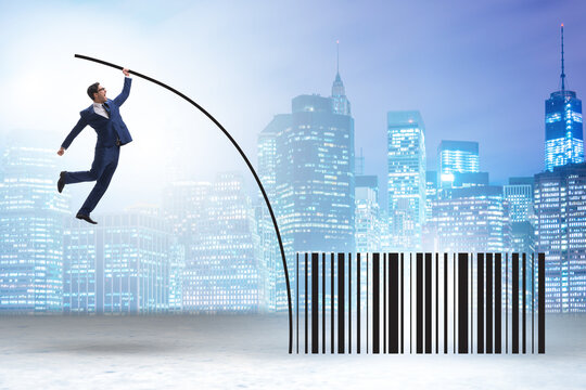 Businessman jumping over bar code in pole vaulting