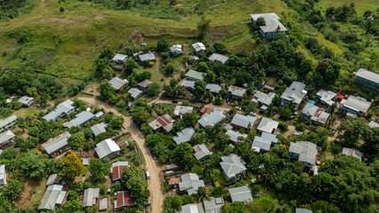 A typical dirt road and housing in Honiara's outer suburbs.