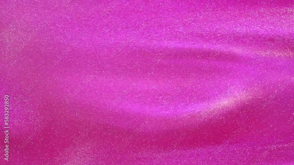 Wall mural silvery dust particles floating in a pink fluid. overflows of luminous particles in a pink liquid. a