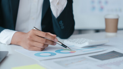 Holding pen, writing notes, Close up hands of asian bookkeeper female working with stack of papers and balance sheet with bureaucracy hardworking in office desk.