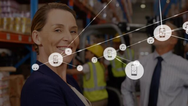 Animation of network of connections with icons over diverse business people working in warehouse