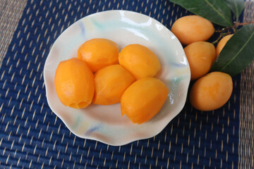 Fresh Peeled Sweet Yellow Marian Plum Fruit or Plum Mango. (Ma Yong Chid in Thai language) Sweet and sour fruit from Thailand.