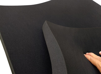 thick black sponge foam with the touch of a finger. a folded sheet of soft and elastic mattress...