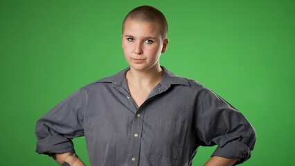 Portrait of angry frustrated despair upset non binary gender fluid young woman 20s isolated isolated on green screen background.