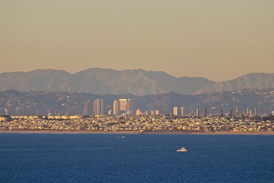Looking out over Santa Monica Bay on a very clear day with Manhattan Beach in the foreground and the skyscrapers of Century City, the Hollywood Hills and the San Gabriel Mountains in the background
