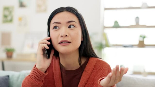 Asian woman, face with phone call and communication, talking with serious expression and technology at home. Conversation, network and contact, female in living room, hand gesturing and discussion