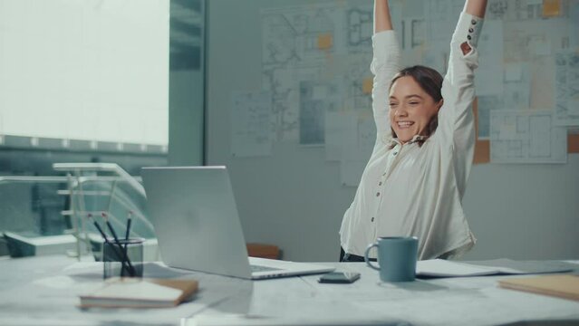 Confident Female Engineer is Typing on a Laptop Computer, Working Online on a New Project. Motivated Female Manager is Doing a New Project. Engineering and Creativity New Product Development