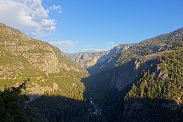 The Merced River cuts through Yosemite Valley, a glacial valley in the Sierra Nevada mountain range of California.