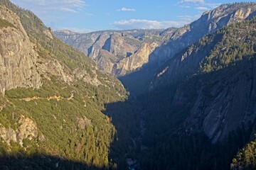 The Merced River cuts through Yosemite Valley, a glacial valley in the Sierra Nevada mountain range...