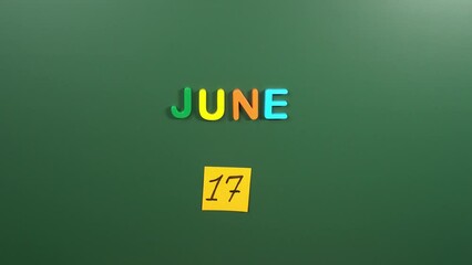 Hand sticking a sticker 17 June calendar day on school board. 17 date of June. Seventeenth day of June. 17th date number. 17 day calendar. Seventeen date. Icelandic National, combat desertification