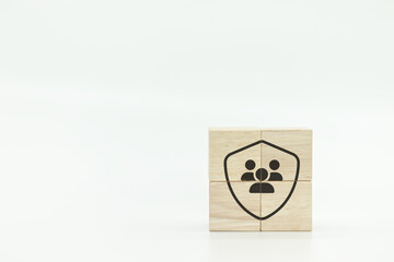 Shield and people group icons on wooden block cubes on white background. Health and life group of employee insurance concept. Employee rights concept. Care for employees. Employee's benefits and engag