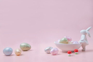 easter bunny and eggs pink background