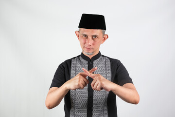 Portrait of Asian Moslem Man says no, stop signal, warning complete, access prohibited. 

