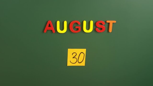 Hand sticking a sticker 30 August calendar day on school board. 30 date of august. Thirtieth day of august. 30th date number. 30 day calendar. Thirty date. Zafer Bayrami Victory Day Turkey