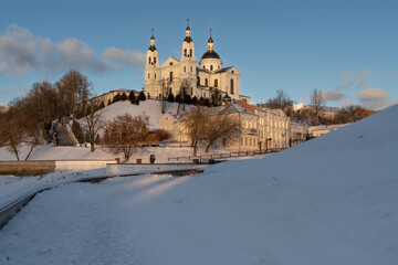 View of the Assumption Mountain, the Holy Spirit Monastery and the Holy Assumption Cathedral on the banks of the Western Dvina and Vitba rivers on a sunny winter day, Vitebsk, Belarus
