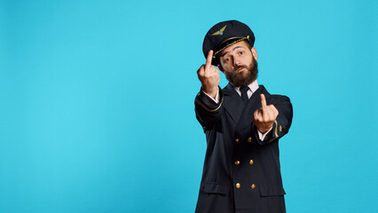 Caucasian airline captain showing middle fingers on camera, advertising negative rude symbol....