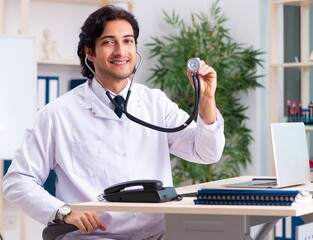 Young doctor cardiologist working in the clinic