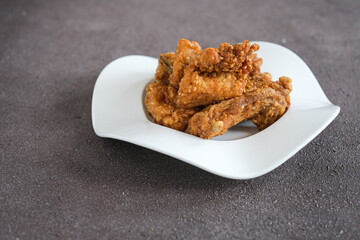 ayam goreng or crispy fried chicken with sesame seeds