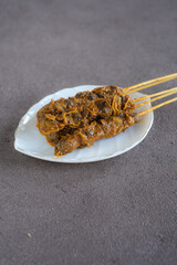 sate kerang, shell satay made from shell with spices like rendang. selective focus