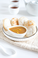 serabi, serabai, apem saus is Indonesian pancake with sauce  made from rice flour, coconut milk, palm sugar and flavour jackfruit