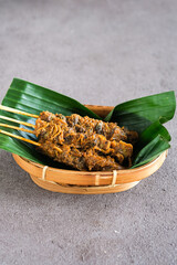 sate kerang, shell satay made from shell with spices like rendang. selective focus