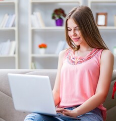 Young woman with shopping bags indoors home on sofa