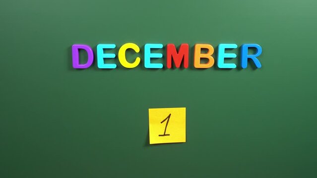Hand sticking a sticker 1 December calendar day on school board. 1 date of December. First day of December. 1st date number. 1 day calendar. One date. Romania great union, World AIDS