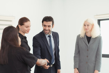 In the company meeting room Young executives are brainstorming ideas about a new business that will launch big soon.