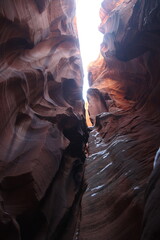 Antelope Canyon is a slot canyon located in Arizona, USA, known for its narrow passageways, dramatic light beams, and smooth sandstone walls..