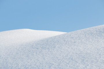 Fototapeta na wymiar Fresh pure soft white winter snow blue sky abstract background