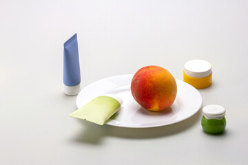 natural peach is an ingredient for medicinal components of ointments and creams used in spa cosmetics on a white milky background.
