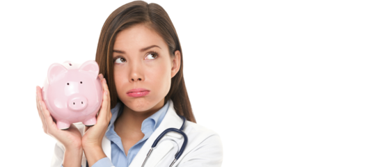 Health care concept. Expensive medical insurance or medical budget cuts. Unhappy doctor woman shaking piggy bank looking sad thinking. Pretty nurse or physician money concept isolated on white.
