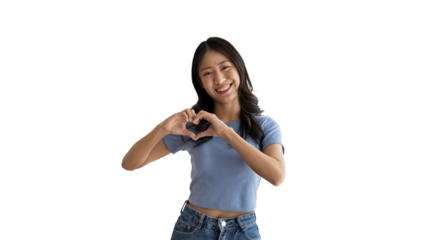 Asian young woman with bright smile making heart symbol shape with hands, Symbol of love and romance, Give each other cuteness and create smiles for each other, Positive thinking concept.
