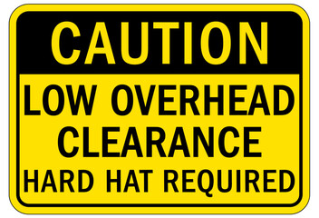 Low overhead clearance warning sign and labels hard hat required
