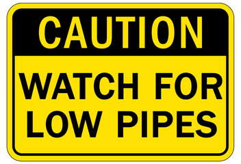 Low headroom warning sign and labels watch for low pipes
