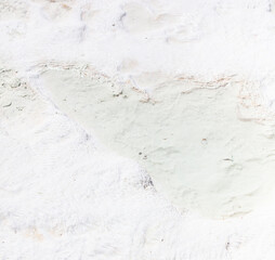 White volcanic limestone rock as background.